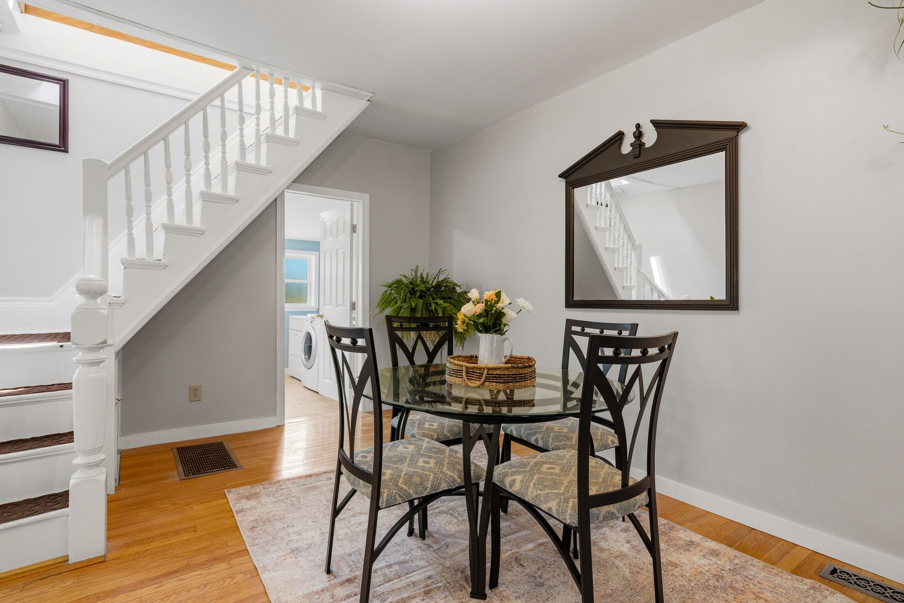 Dining area with the quaint original staircase on the historic side