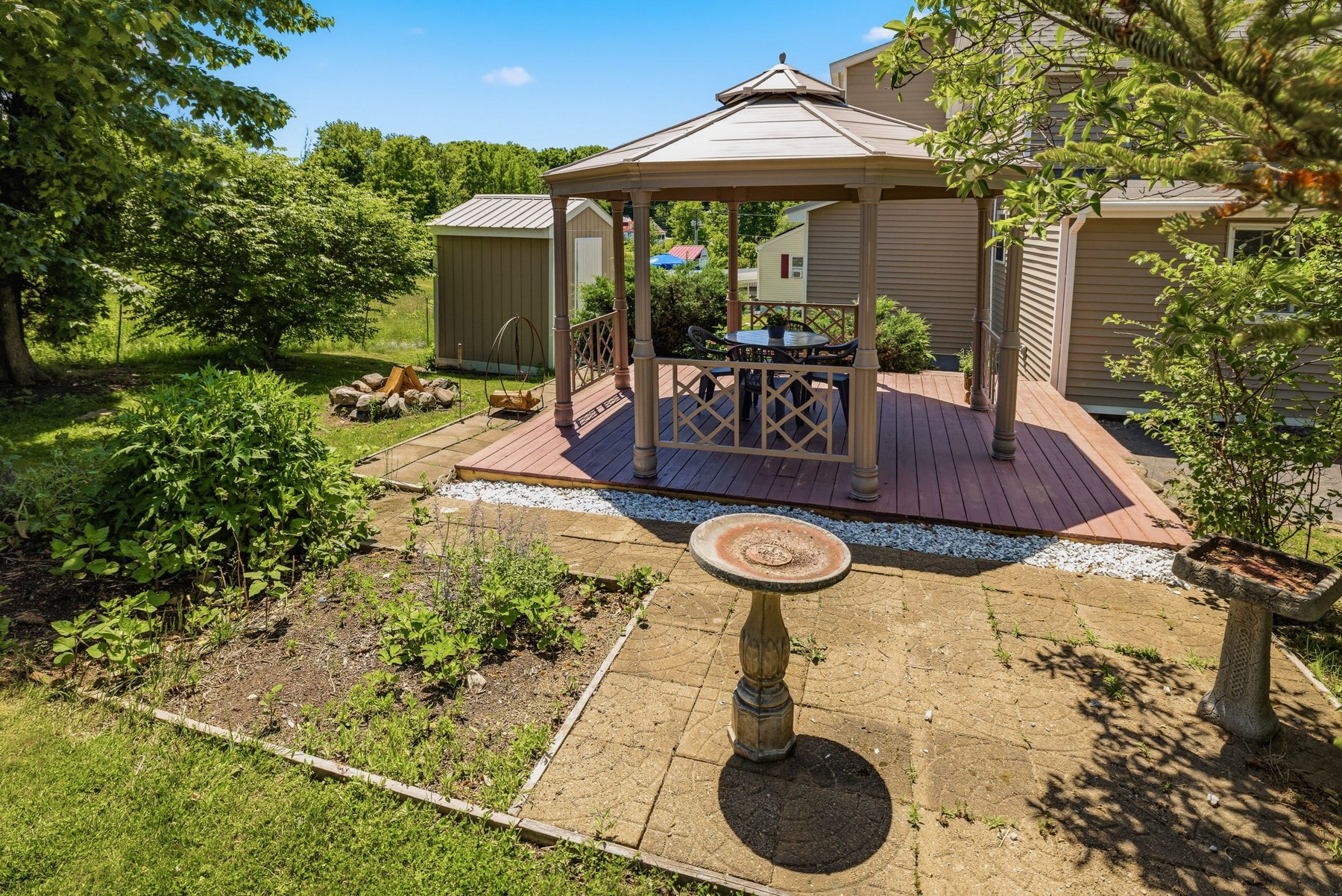 Elevated view of the gazebo deck, garden beds, birdbath and shed