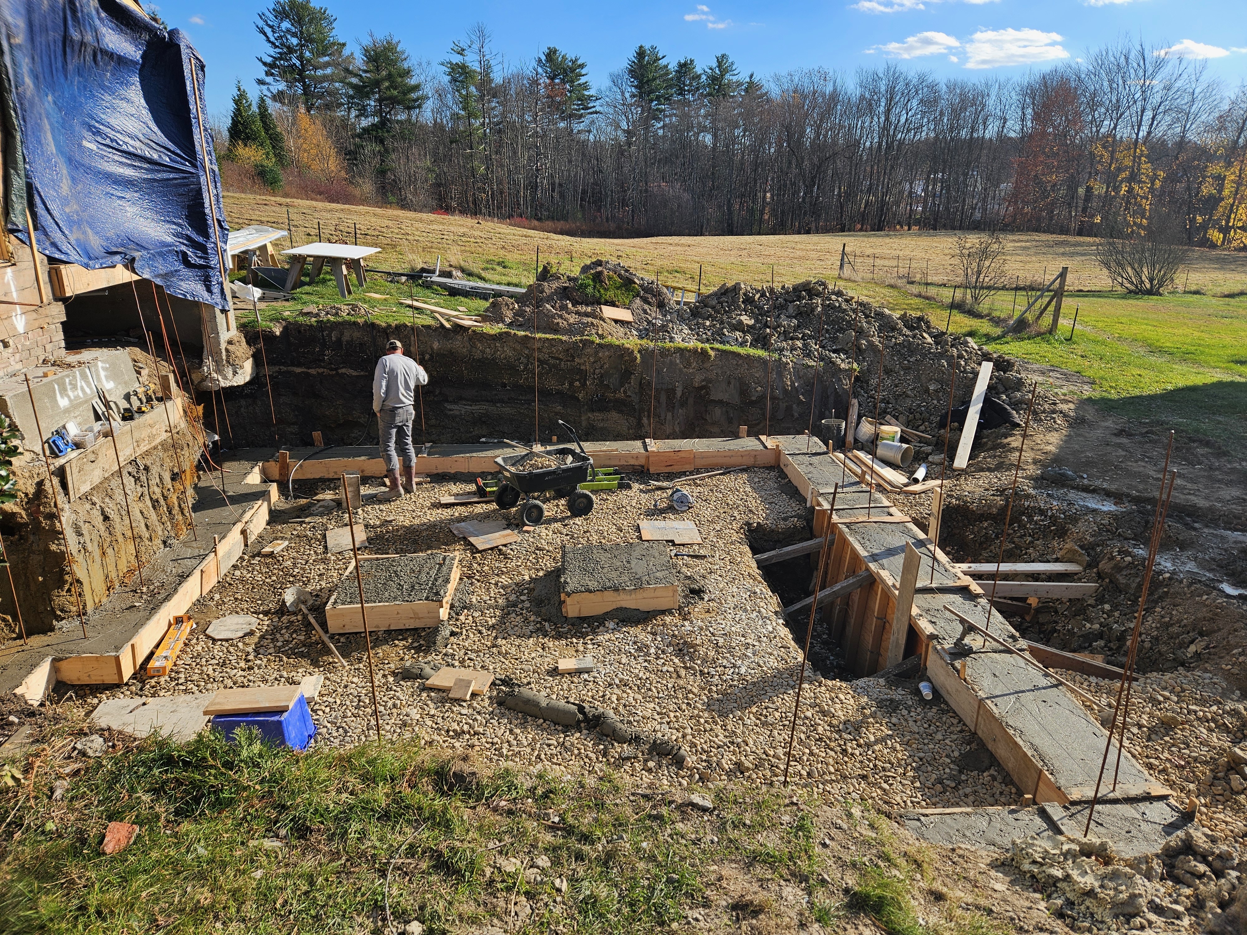 Side A under construction — the new home's foundation poured from the ground up